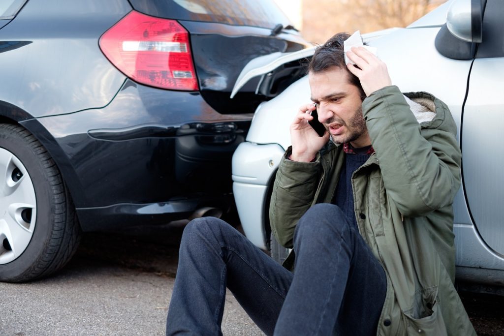 man feeling stressed after car accident