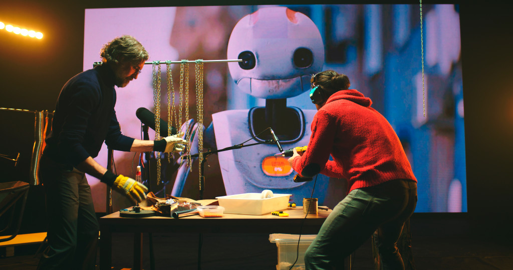 two men desigining a robot digital