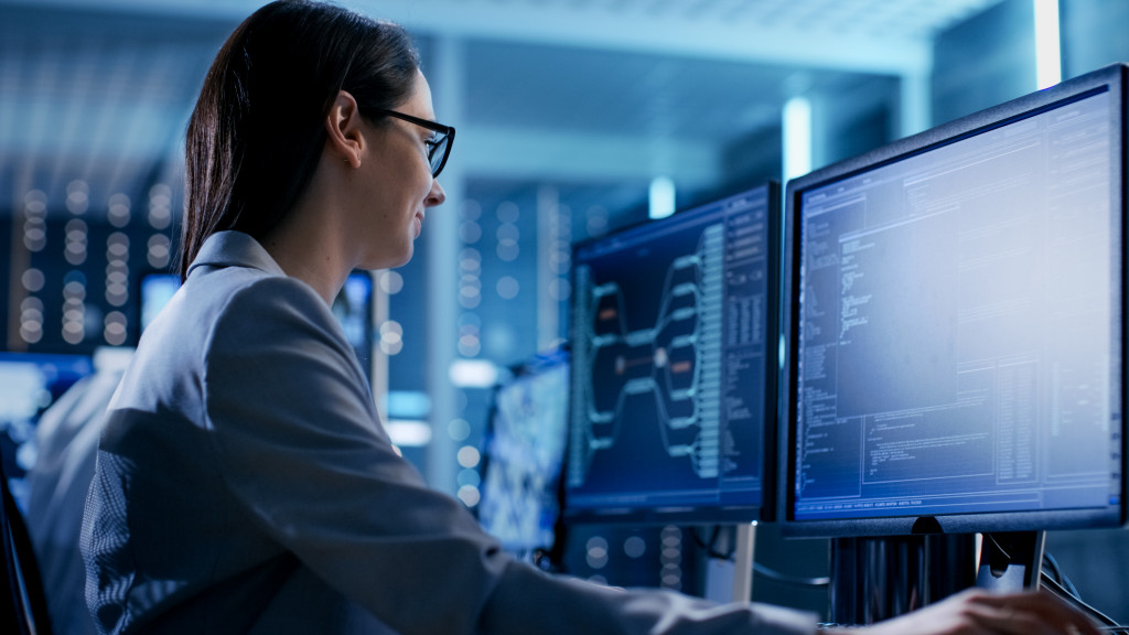 Cybersecurity technician monitoring a system.